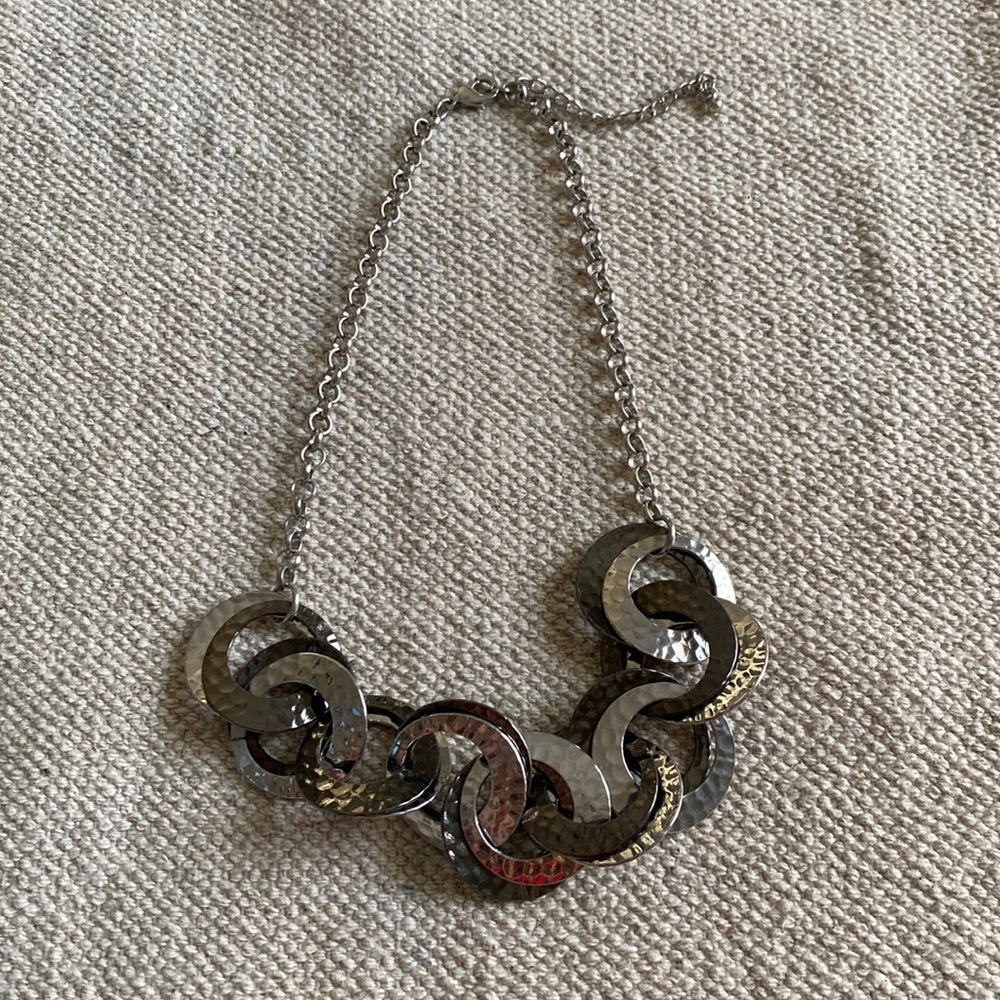 silver necklace with hammered, intertwined circular plates